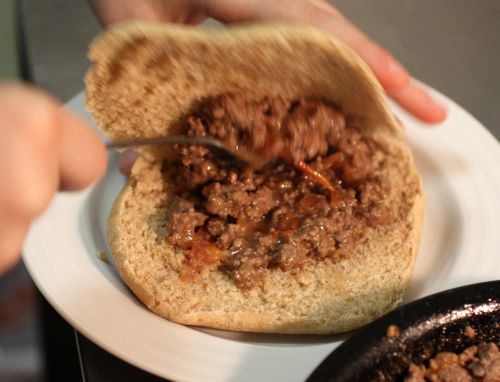 Putting the meat into a pita