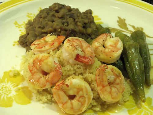 Thick curried lentils as a side dish for pineapple shrimp and okra, over couscous