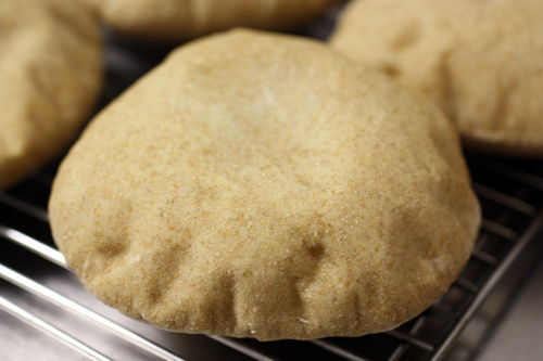 Close up of a cooked, puffed pitas