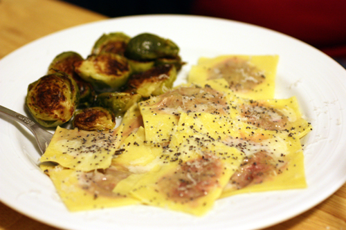 Beet and ricotta filled ravioli with brussels sprouts on the side